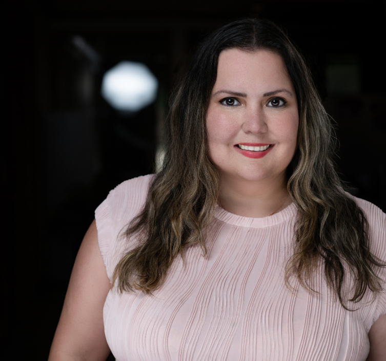 A professional photo of a woman smiling.