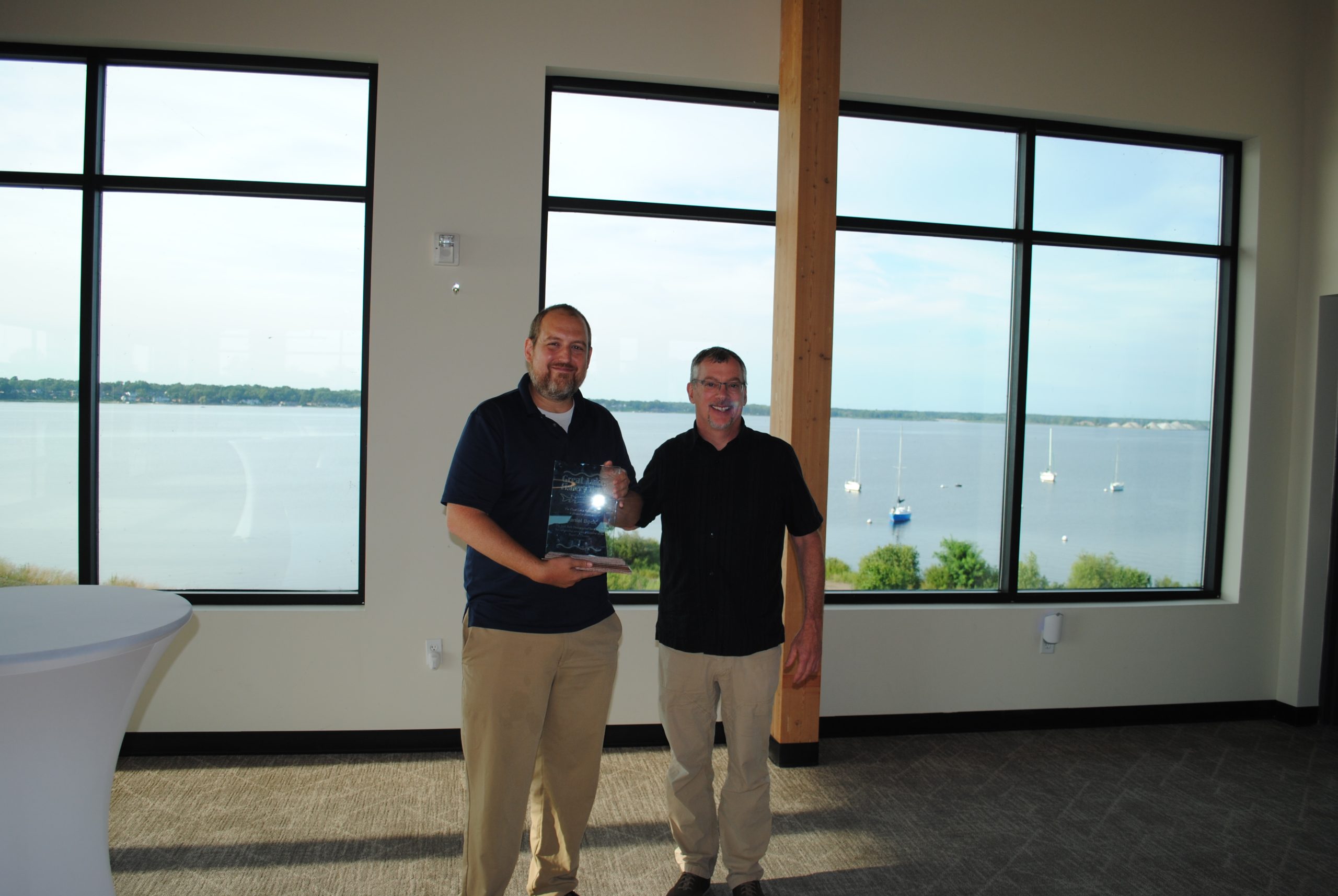 A picture of Attorney Dan Bock Receiving an Award from the Michigan Department of Natural Resources (DNR) Fisheries Chief